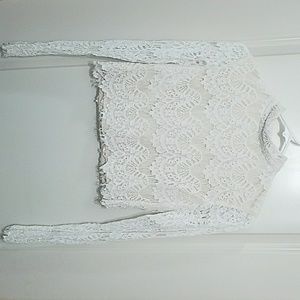 White long sleeve lace crop top with open back